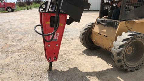 skid steer hanging from crane jack hammering|skid steer attachment rental.